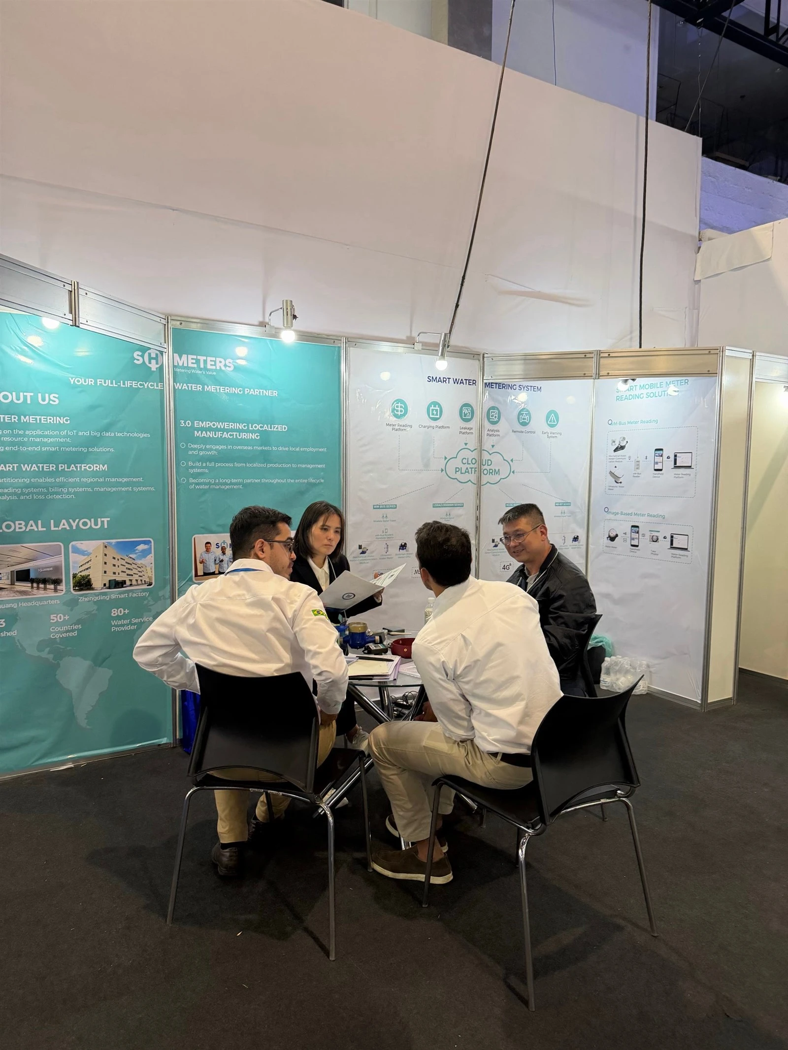 SH Meters team discussing water metering solutions with industry visitors SH Meters team discussing water metering solutions with industry visitors