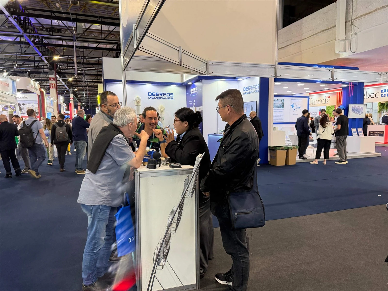 SH Meters team discussing water metering solutions with industry visitors SH Meters team discussing water metering solutions with industry visitors